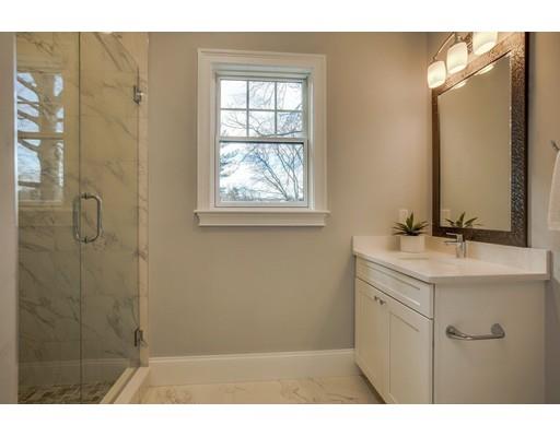 21 Fairhaven Road Newton, MA 02459 - Photo 23 of 30 a bathroom with a sink a mirror and shower