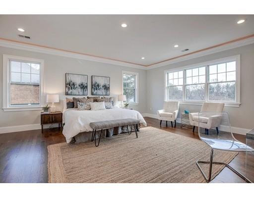 21 Fairhaven Road Newton, MA 02459 - Photo 25 of 30 a bedroom with a bed and wooden floor