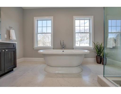 21 Fairhaven Road Newton, MA 02459 - Photo 27 of 30 a bathroom with a bathtub and potted plant