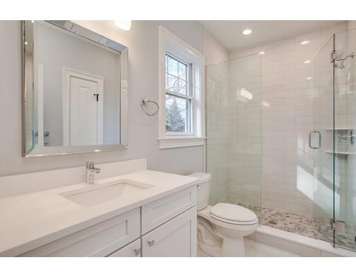 21 Fairhaven Road Newton, MA 02459 - Photo 29 of 30 a bathroom with a sink toilet a mirror and shower