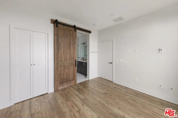 a bathroom with a double vanity sink and mirror