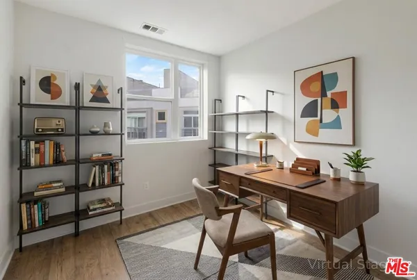 a view of a room with cabinet and a window