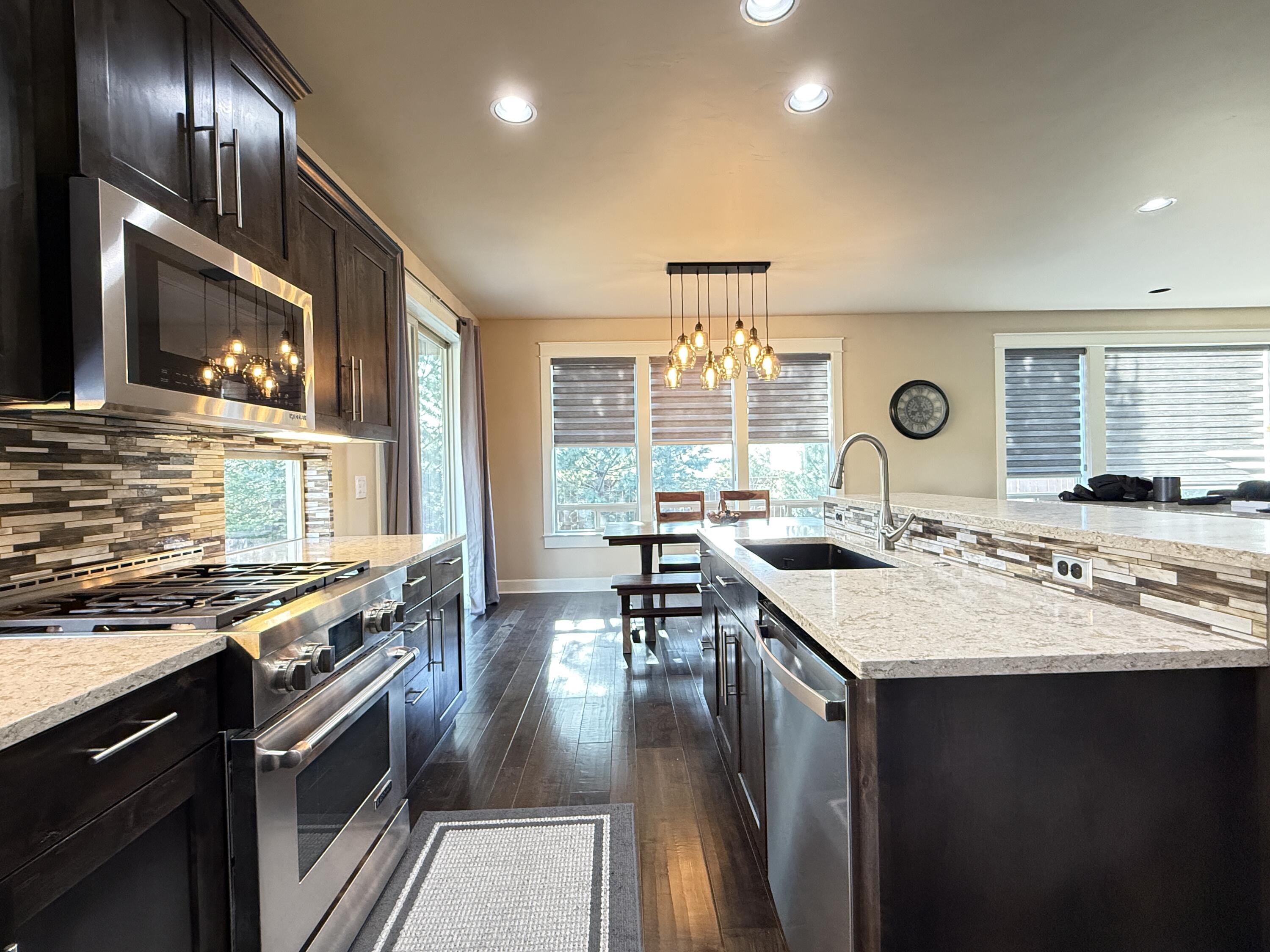 61072 Manhae Loop Bend, OR 97702 - Photo 5 of 63 a kitchen with lots of counter top space
