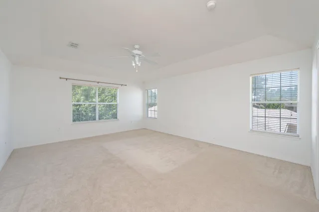 an empty room with windows