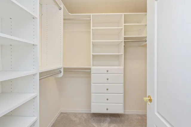 a view of an empty walk in closet