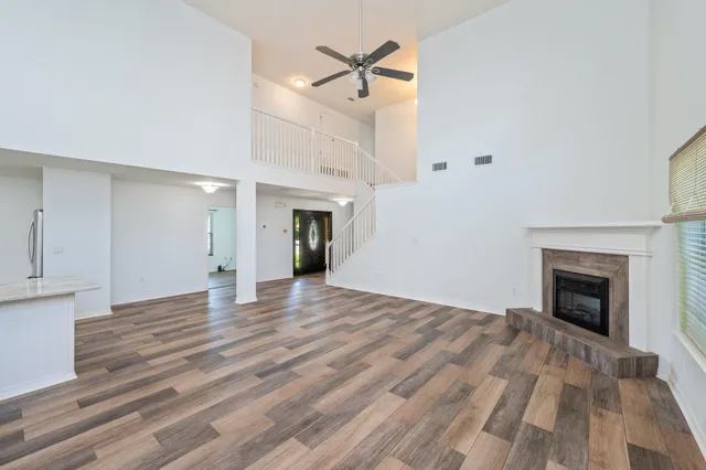 a view of an empty room and fire place