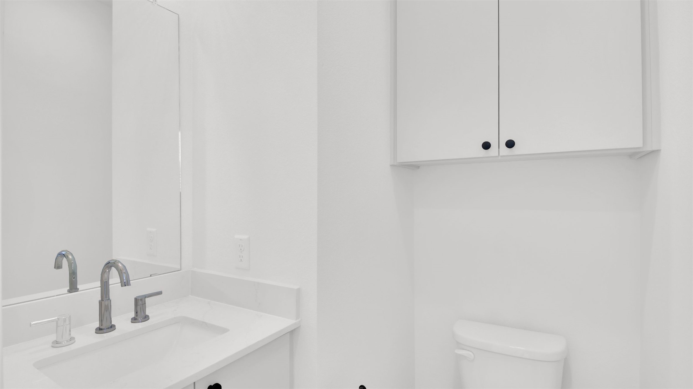 7208 Providence Avenue, Unit 2 Austin, TX 78752 - Photo 11 of 19 a bathroom with a sink and a mirror