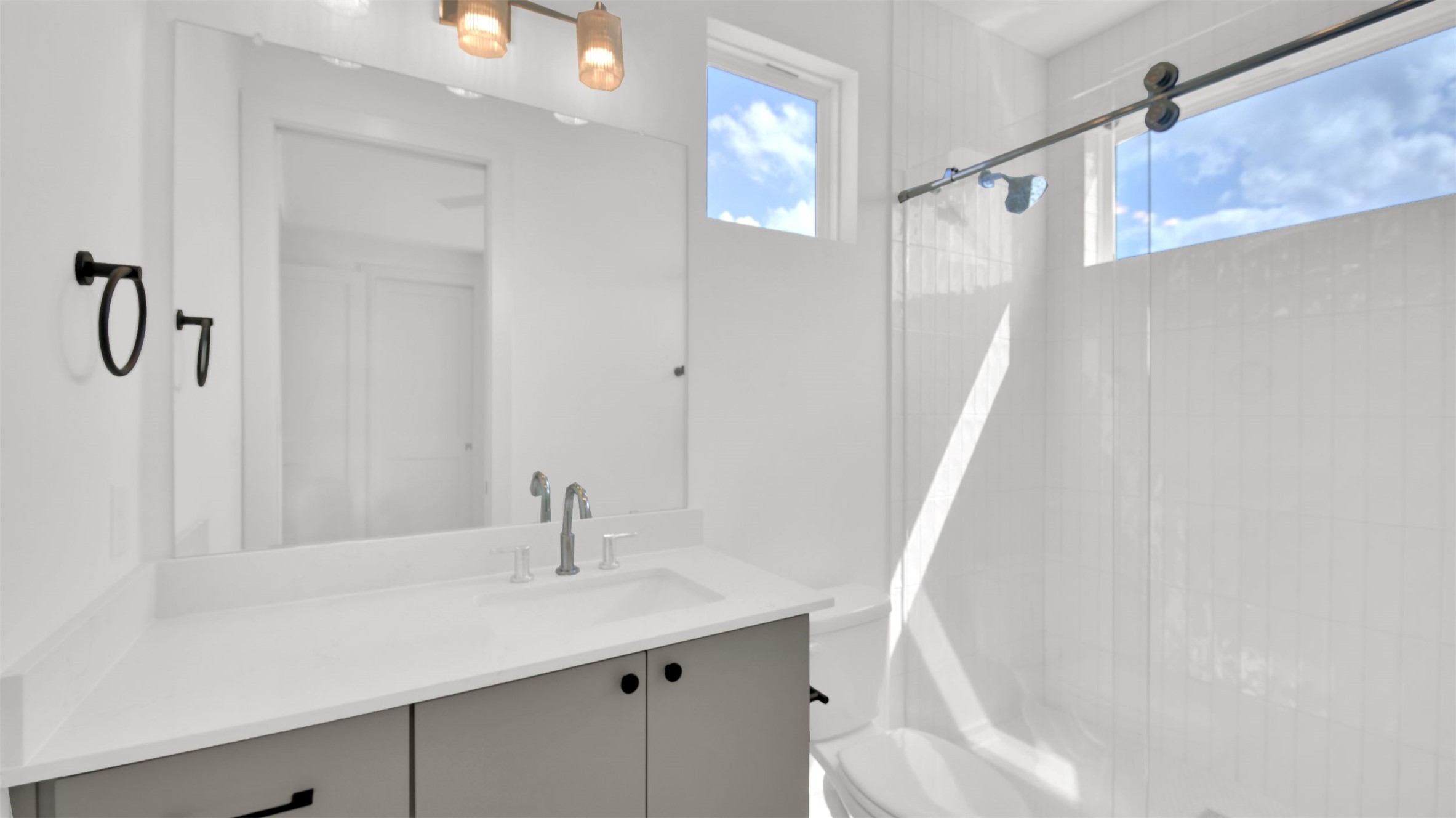 7208 Providence Avenue, Unit 2 Austin, TX 78752 - Photo 17 of 19 a bathroom with a sink and a mirror