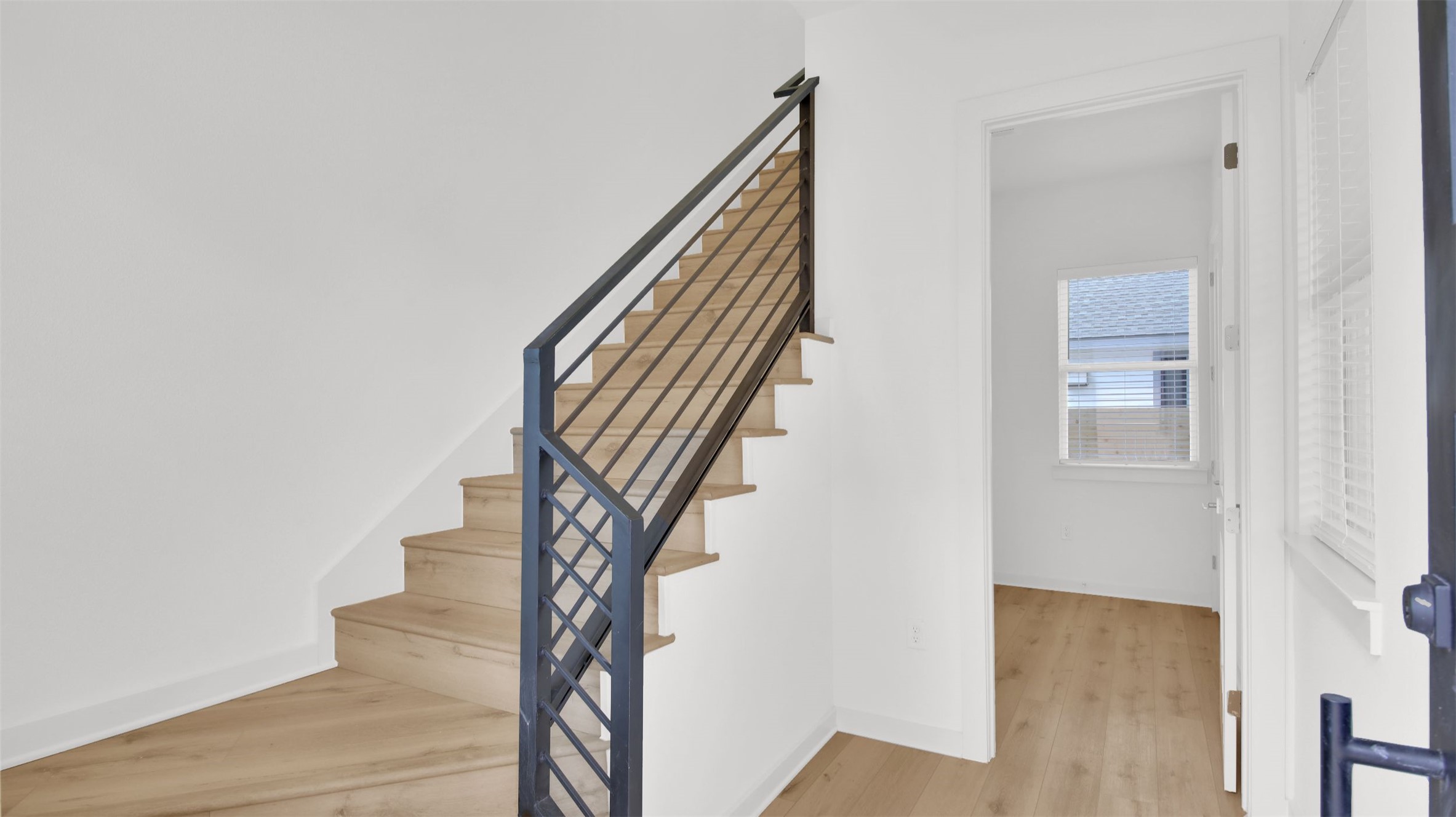 7208 Providence Avenue, Unit 2 Austin, TX 78752 - Photo 6 of 19 a view of entryway and hall with wooden floor