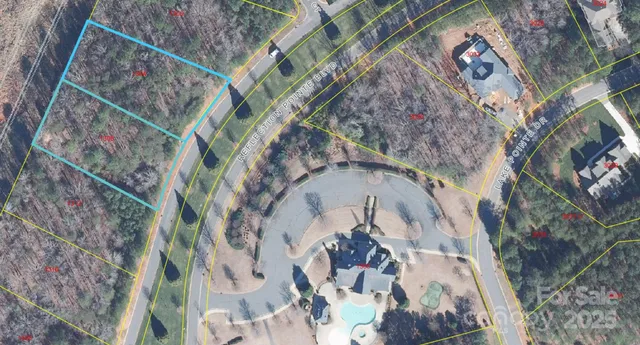 a view of a house with a yard balcony and sitting area