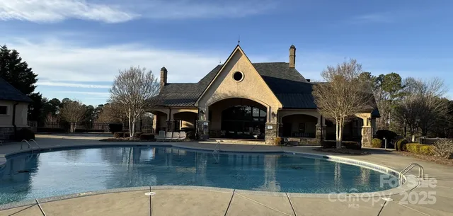 a view of a swimming pool with a patio