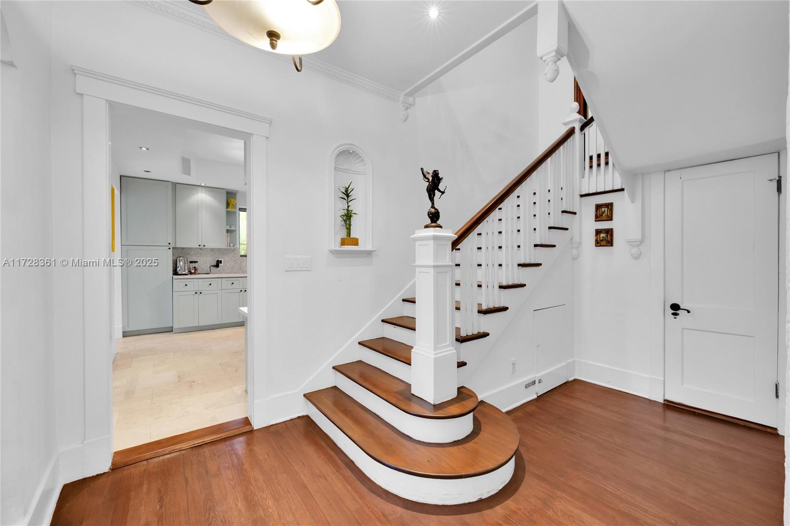 178 Northeast 45th Street Miami, FL 33137 - Photo 13 of 47 a view of entryway with wooden floor
