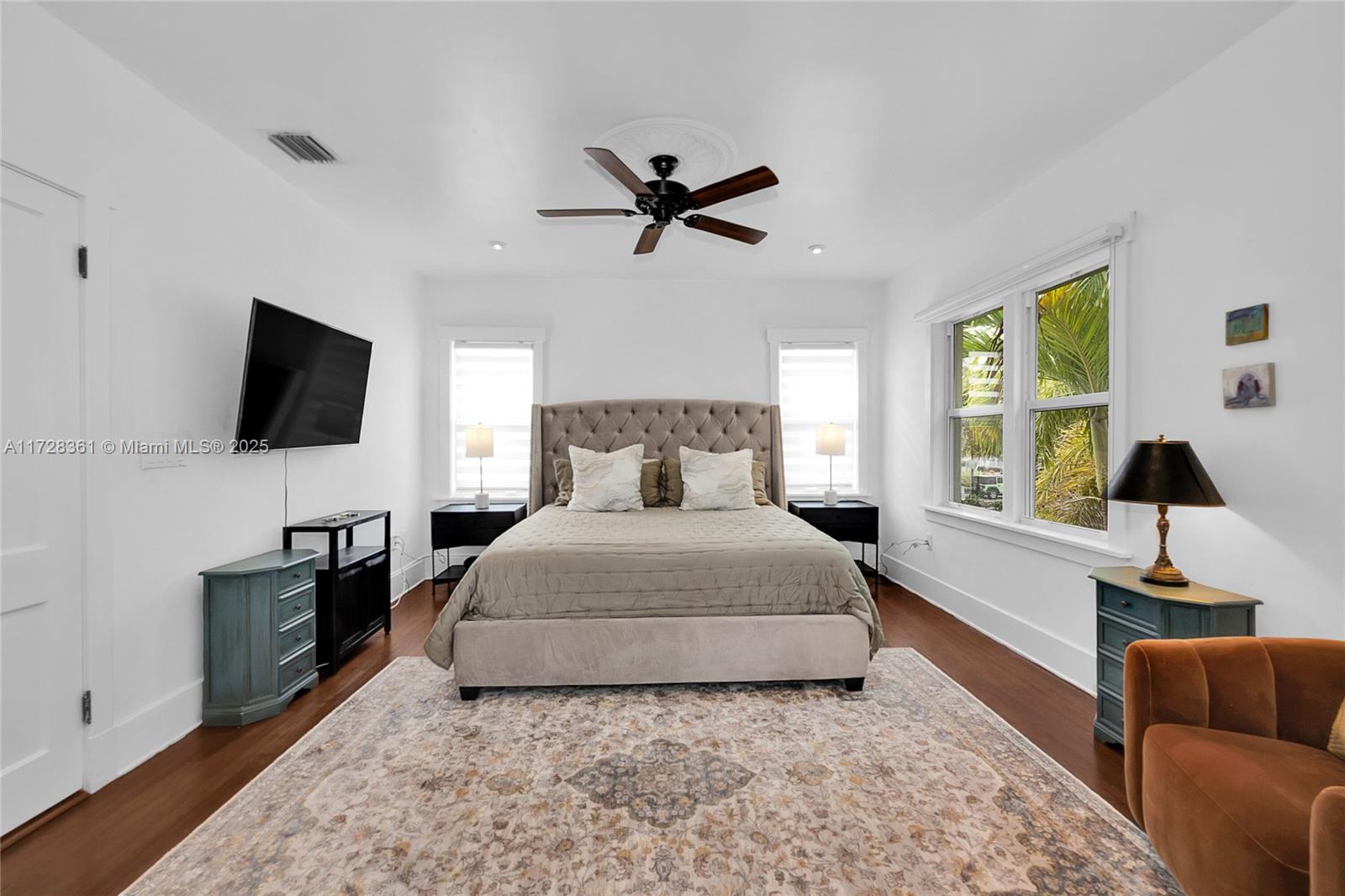 178 Northeast 45th Street Miami, FL 33137 - Photo 16 of 47 a bedroom with a bed and a flat screen tv