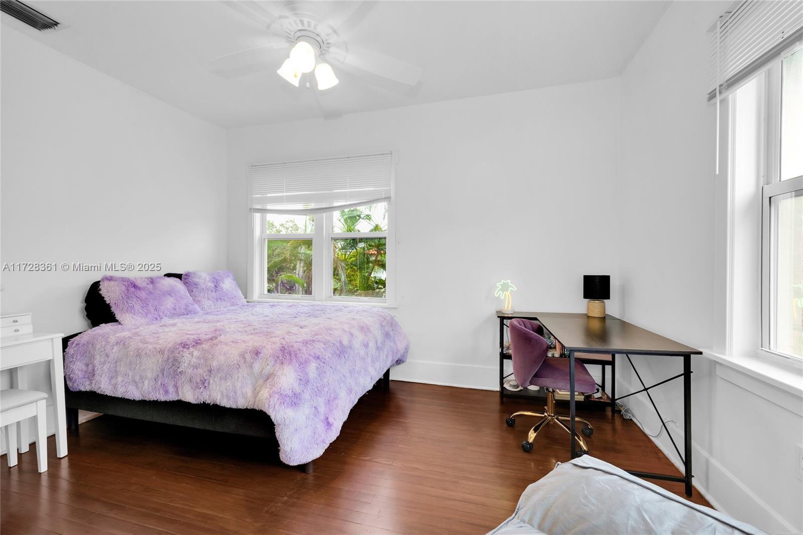 178 Northeast 45th Street Miami, FL 33137 - Photo 26 of 47 a bedroom with a bed and a chandelier