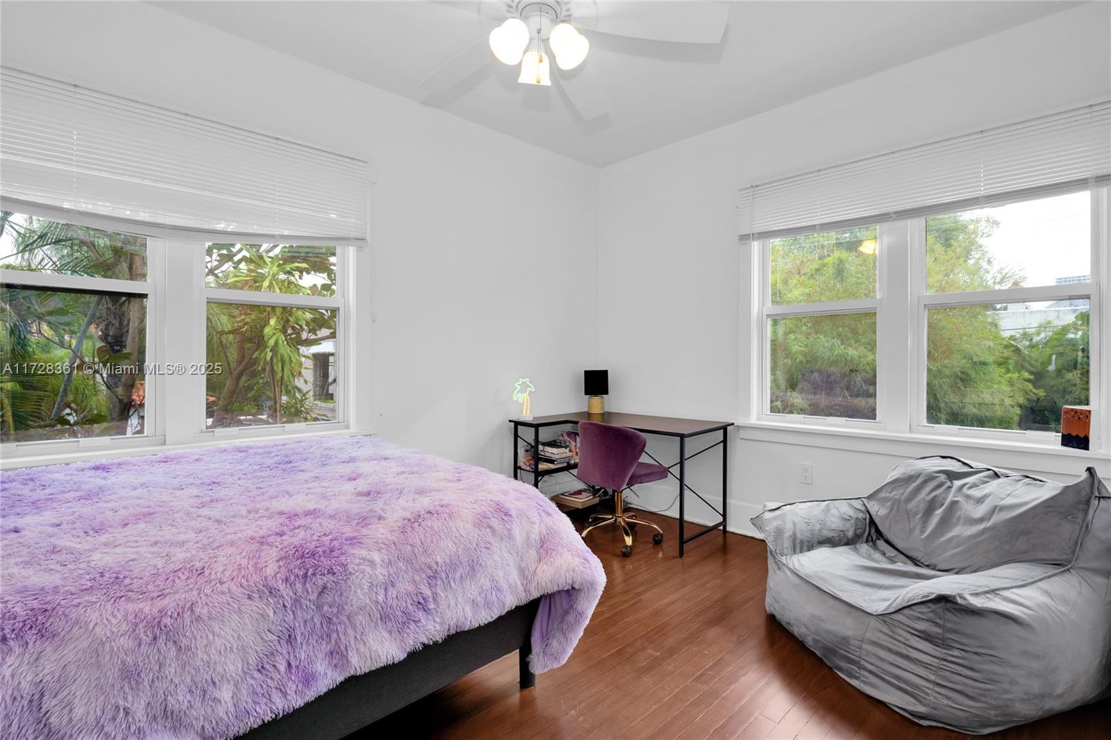 178 Northeast 45th Street Miami, FL 33137 - Photo 27 of 47 a spacious bedroom with a bed and a large window