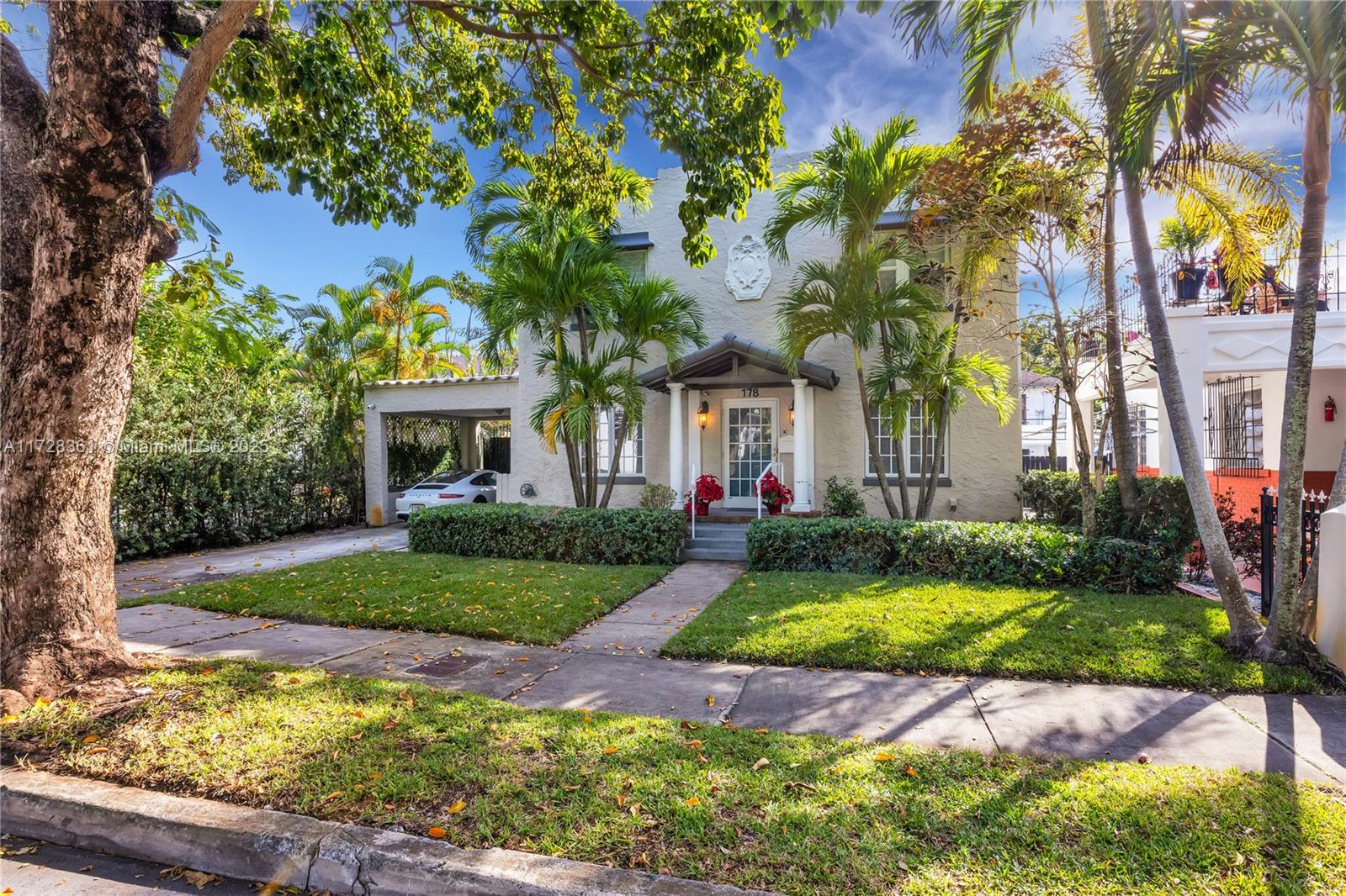 178 Northeast 45th Street Miami, FL 33137 - Photo 37 of 47 a front view of a house with a yard and a garden