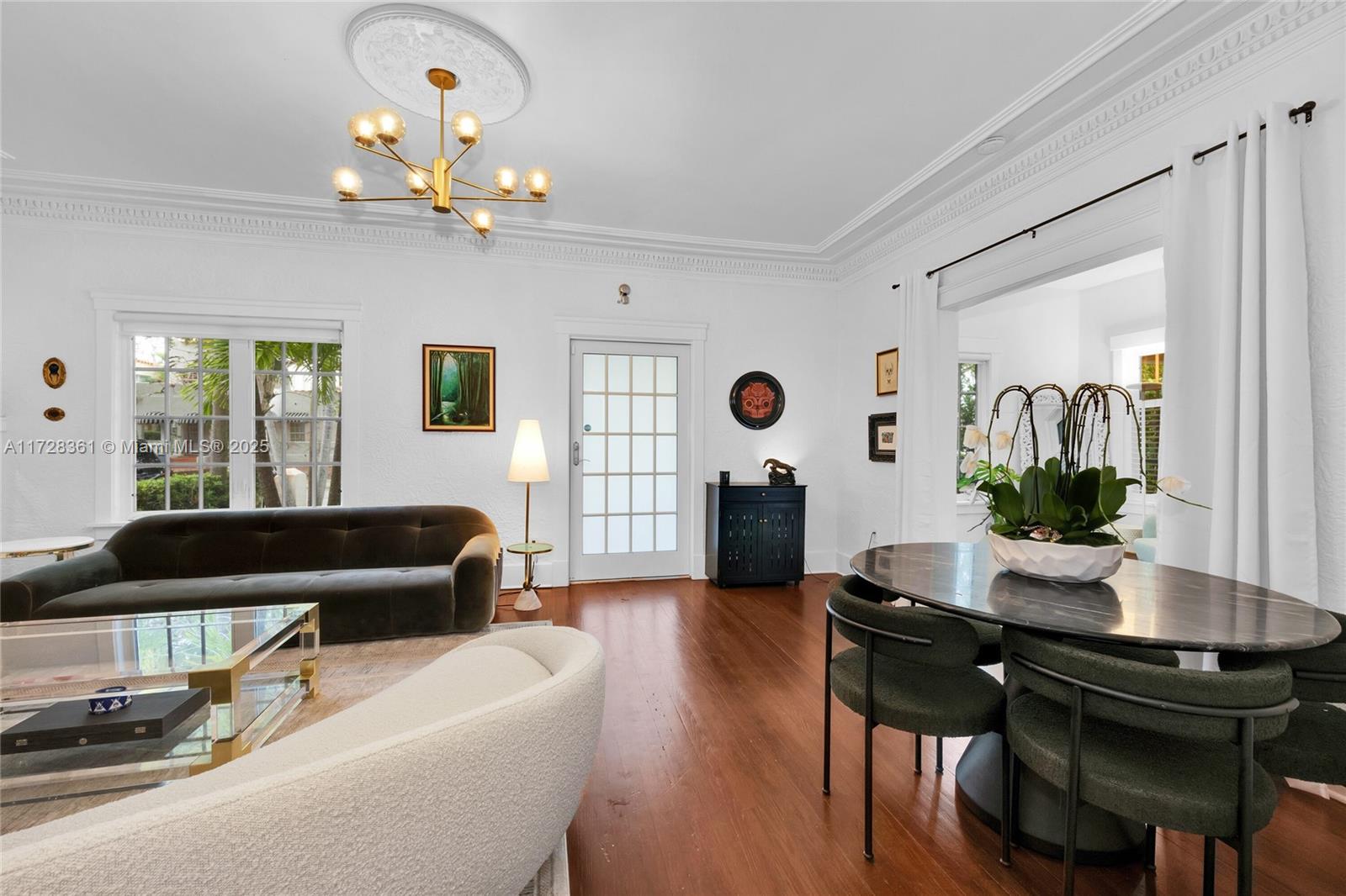178 Northeast 45th Street Miami, FL 33137 - Photo 6 of 47 a living room with furniture and a chandelier