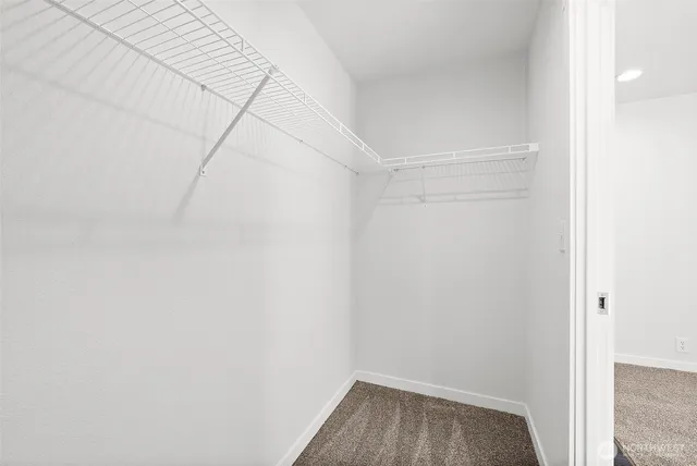 a bathroom with a shower sink and mirror