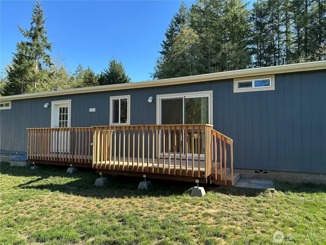 a view of a backyard with swimming pool