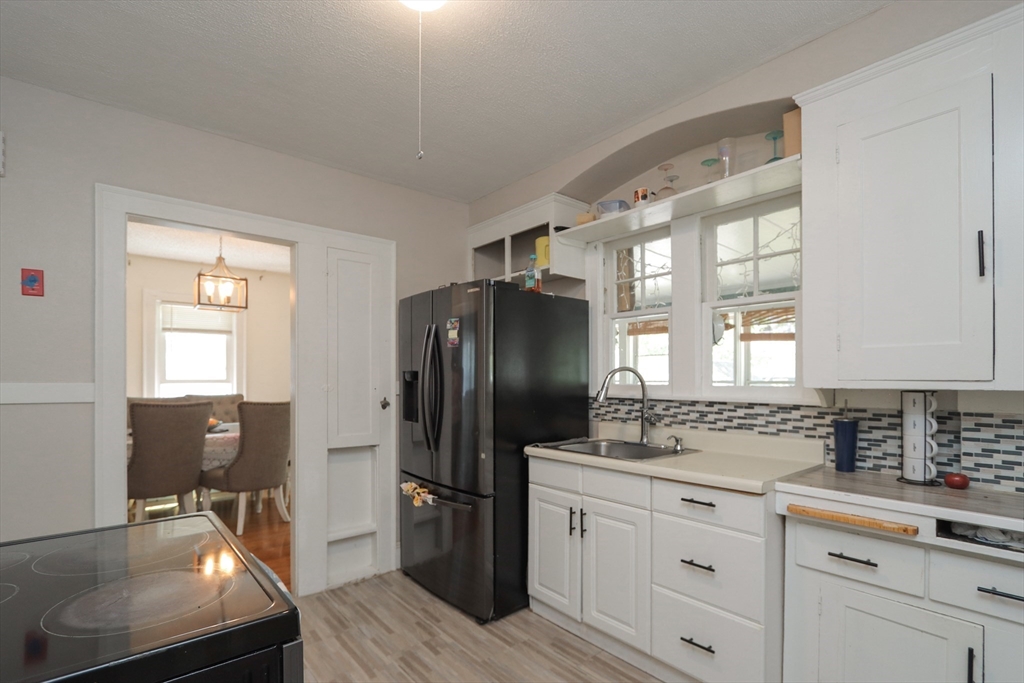 34 Preston Street Springfield, MA 01109 - Photo 10 of 34 a kitchen with stainless steel appliances a refrigerator sink and cabinets