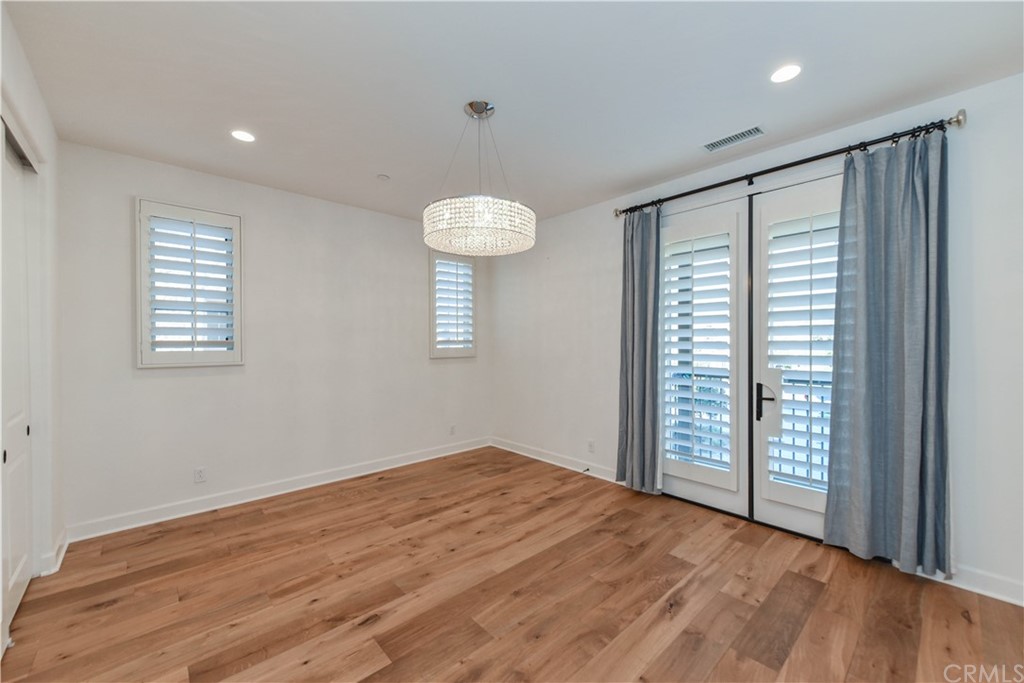 71 Sunset Cove Irvine, CA 92602 - Photo 15 of 55 an empty room with wooden floor and windows