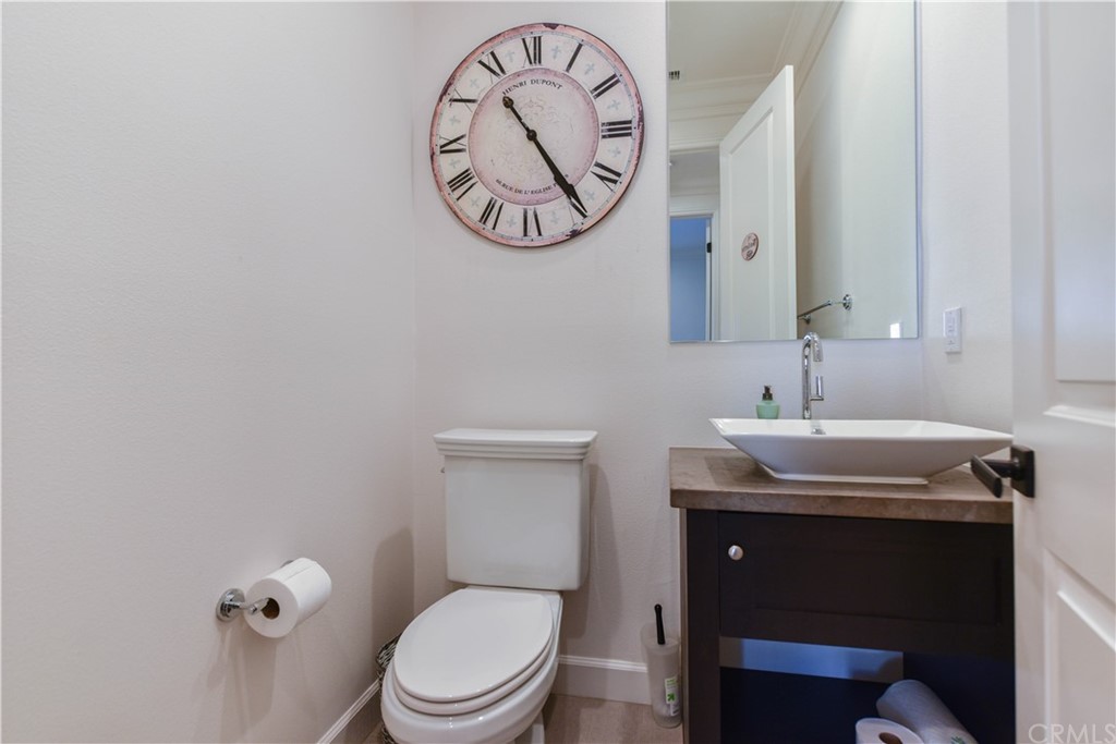 71 Sunset Cove Irvine, CA 92602 - Photo 16 of 55 a bathroom with a granite countertop toilet sink and mirror