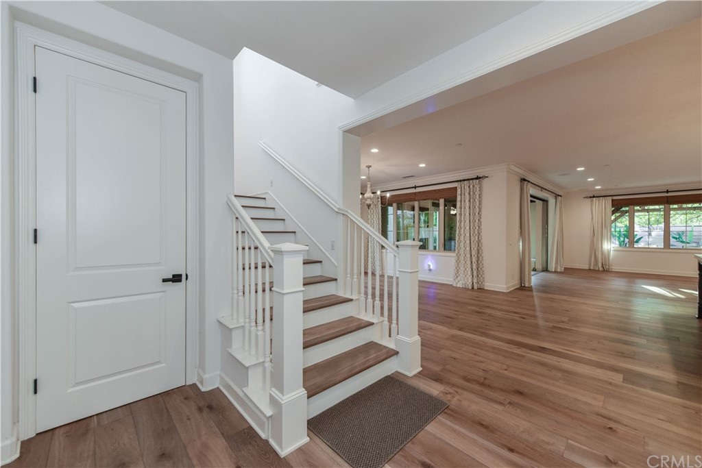 71 Sunset Cove Irvine, CA 92602 - Photo 17 of 55 a view of entryway with wooden floor and stairs