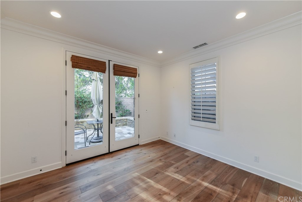 71 Sunset Cove Irvine, CA 92602 - Photo 38 of 55 a view of an empty room with wooden floor and a window
