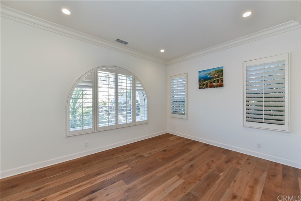 71 Sunset Cove Irvine, CA 92602 - Photo 42 of 55 an empty room with wooden floor and windows