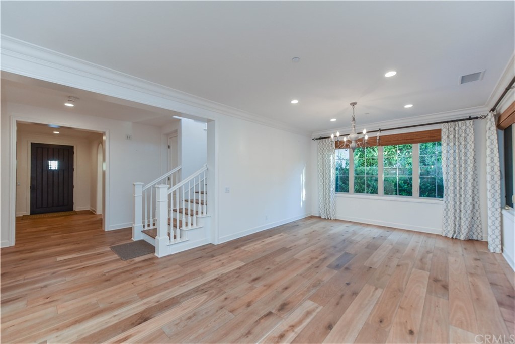 71 Sunset Cove Irvine, CA 92602 - Photo 7 of 55 a view of an empty room with wooden floor and a window