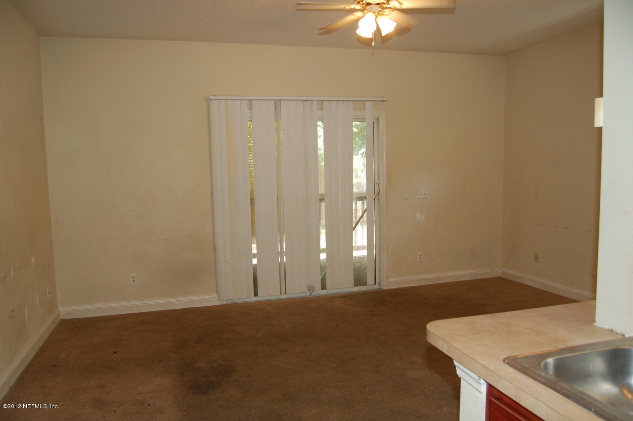 4693 Barnes Road South Jacksonville, FL 32207 - Photo 3 of 12 a view of a room with a sink and chandelier fan