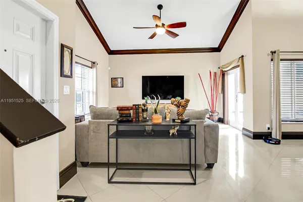 a kitchen with stainless steel appliances granite countertop a sink and a refrigerator