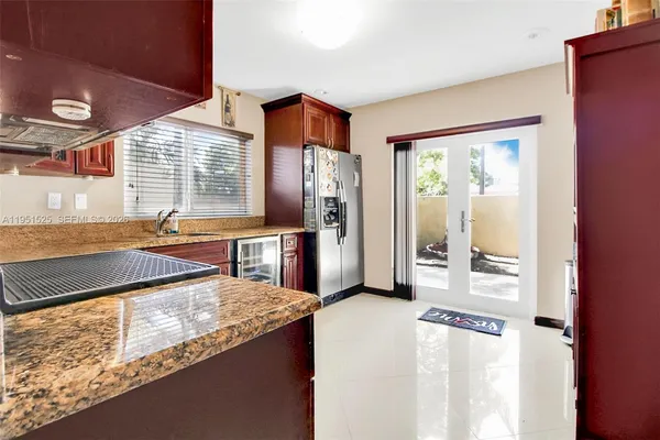 a kitchen with stainless steel appliances granite countertop a stove and a refrigerator