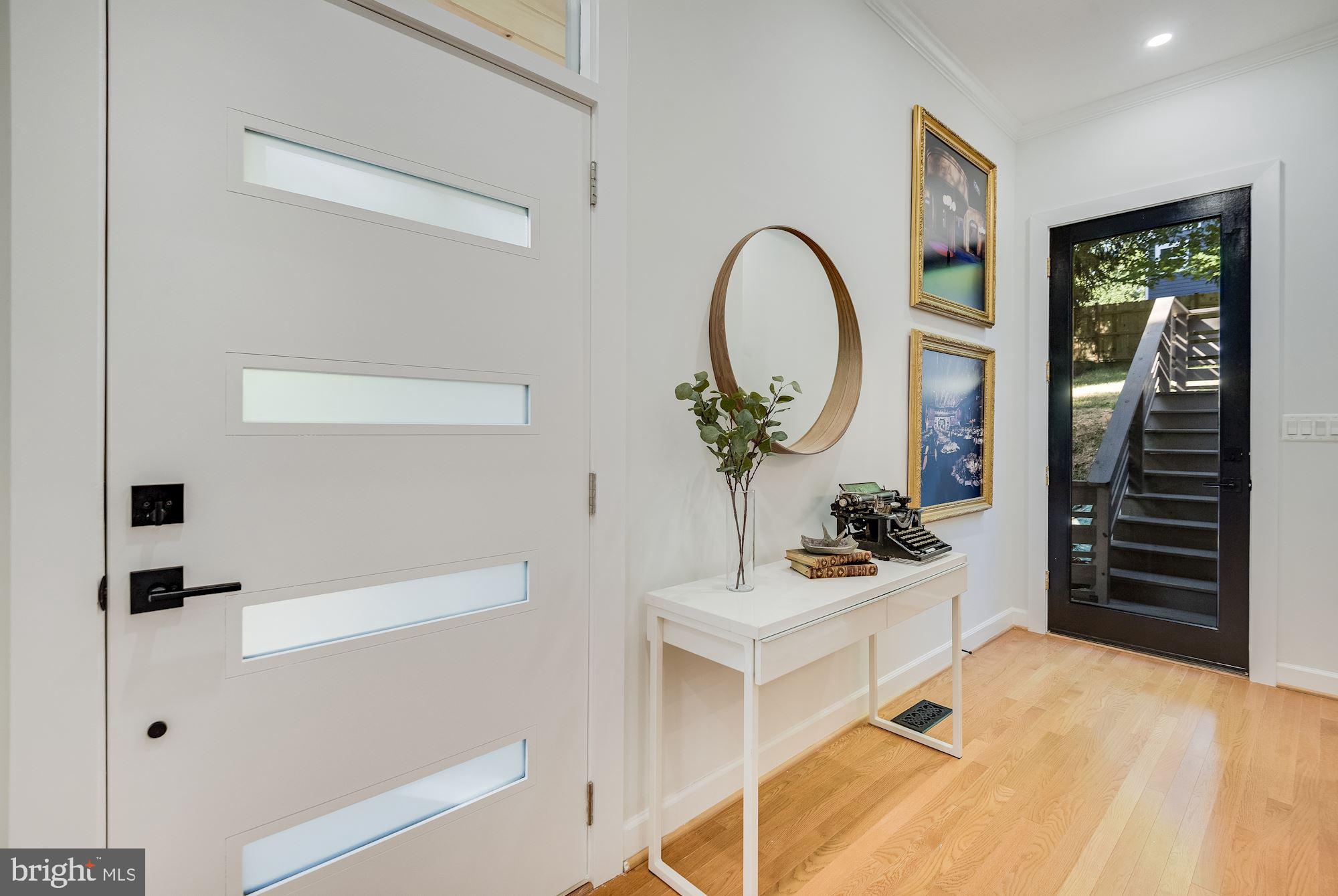 17 Ritchie Avenue Silver Spring, MD 20910 - Photo 5 of 38 Airy foyer with cool contemporary door.