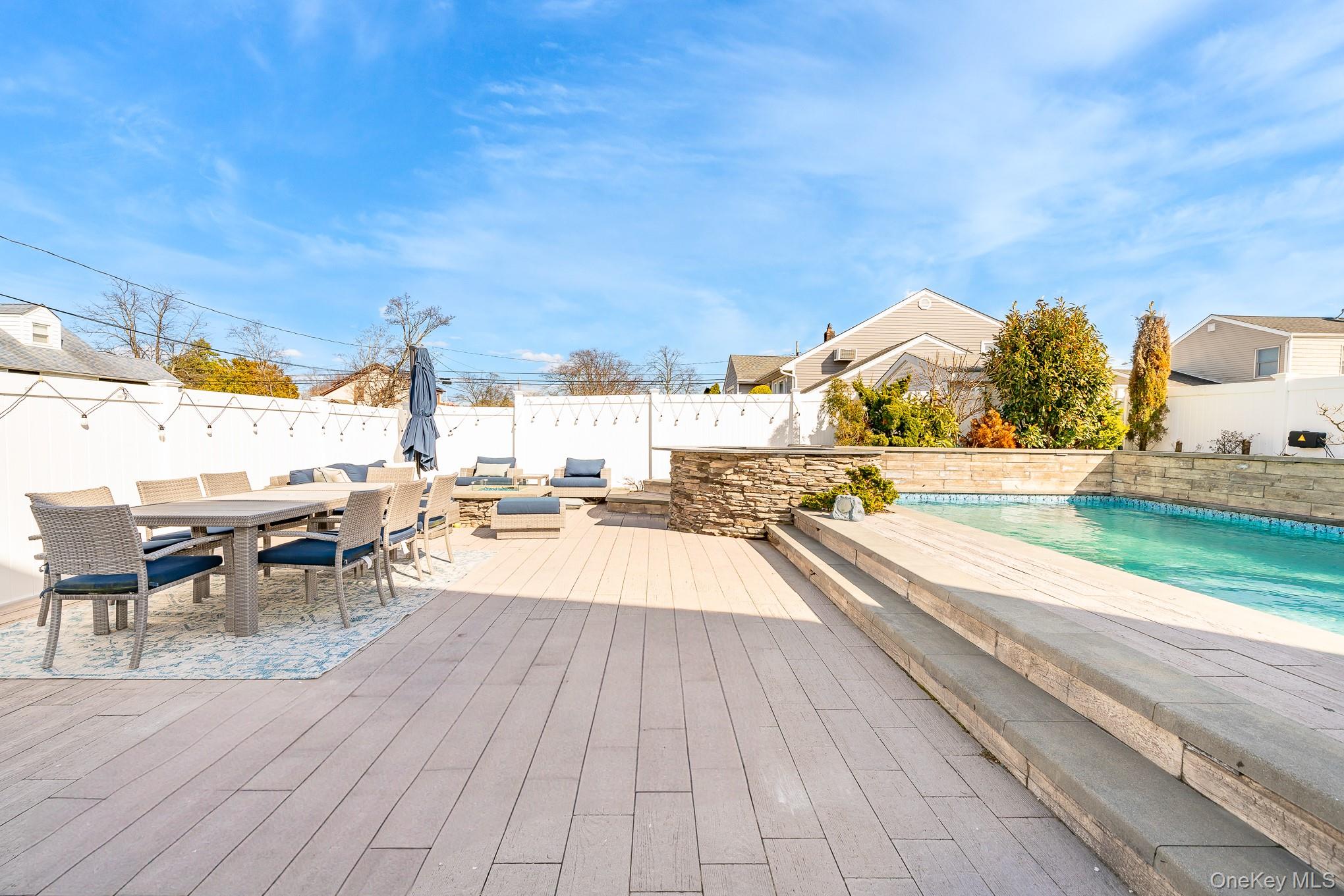 2431 Riverside Drive Wantagh, NY 11793 - Photo 3 of 23 a view of a swimming pool with a lounge chair