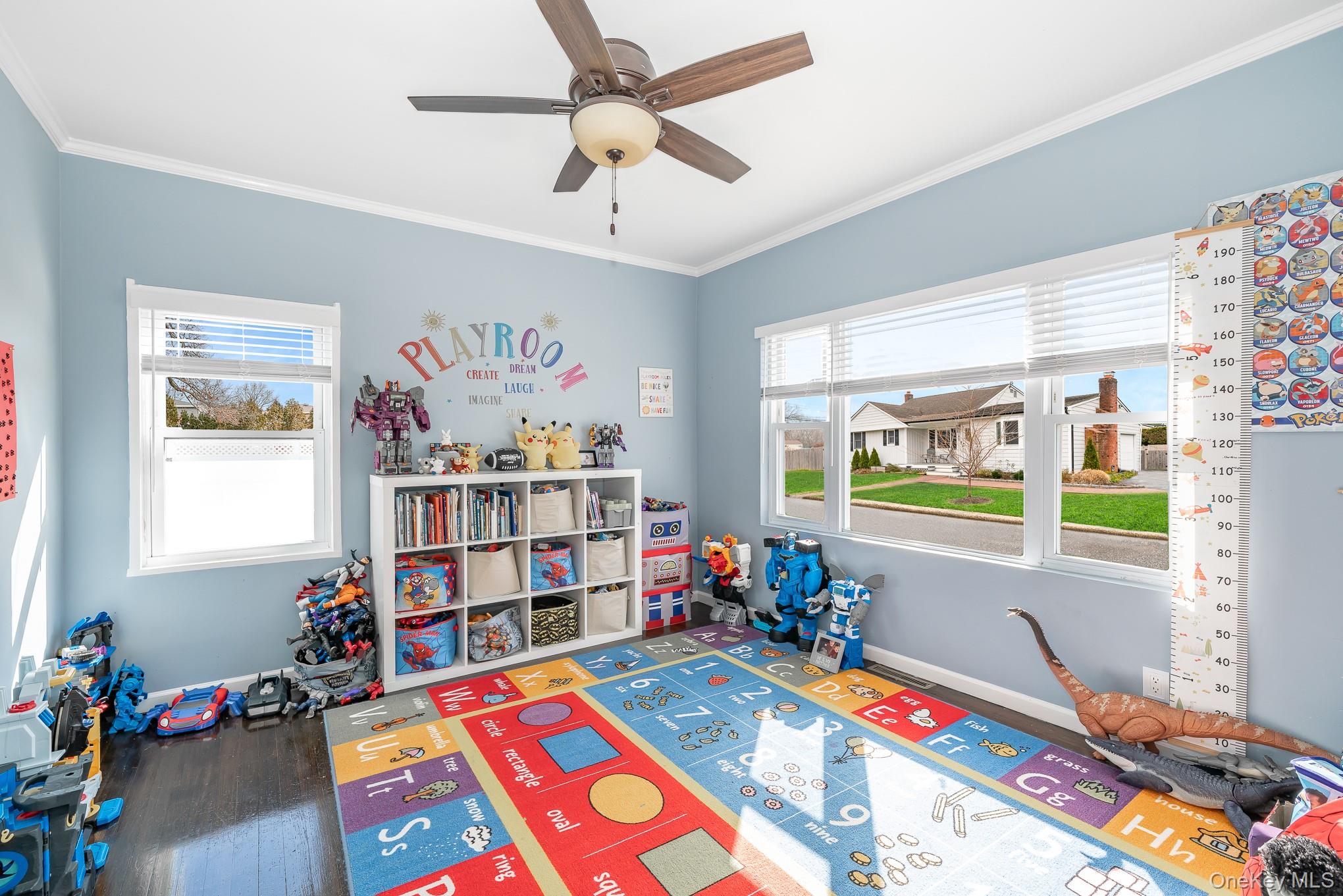 2431 Riverside Drive Wantagh, NY 11793 - Photo 5 of 23 a room with furniture a baby crib and a window