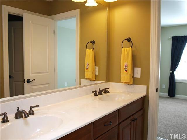 12316 Beestone Lane Raleigh, NC 27614 - Photo 13 of 20 a bathroom with a double vanity sink and a mirror