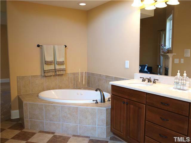 12316 Beestone Lane Raleigh, NC 27614 - Photo 16 of 20 a bathroom with a bathtub and a sink