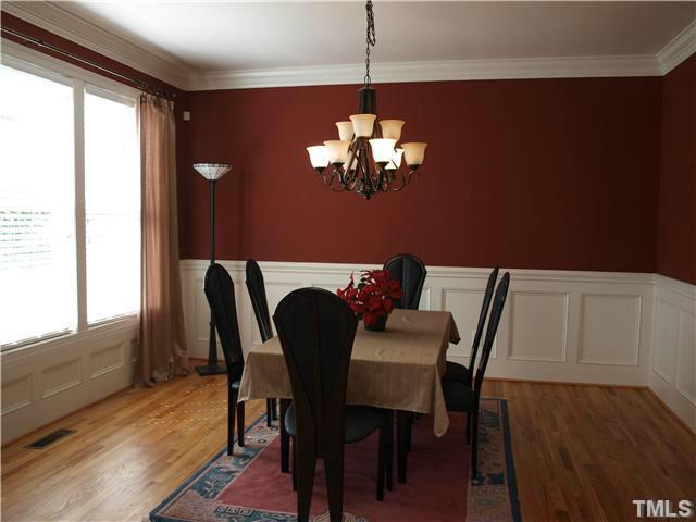 12316 Beestone Lane Raleigh, NC 27614 - Photo 3 of 20 a view of a dining room with furniture and chandelier
