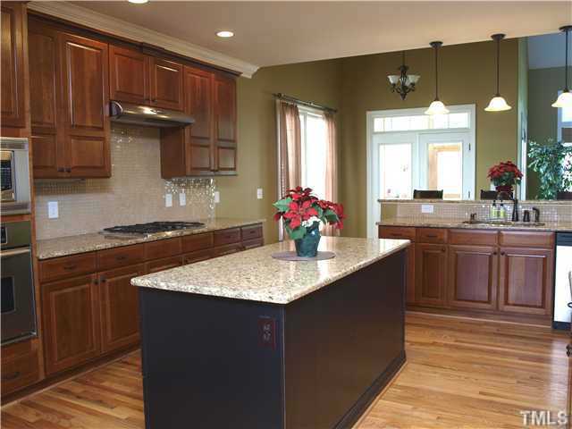 12316 Beestone Lane Raleigh, NC 27614 - Photo 8 of 20 a kitchen with a sink and cabinets