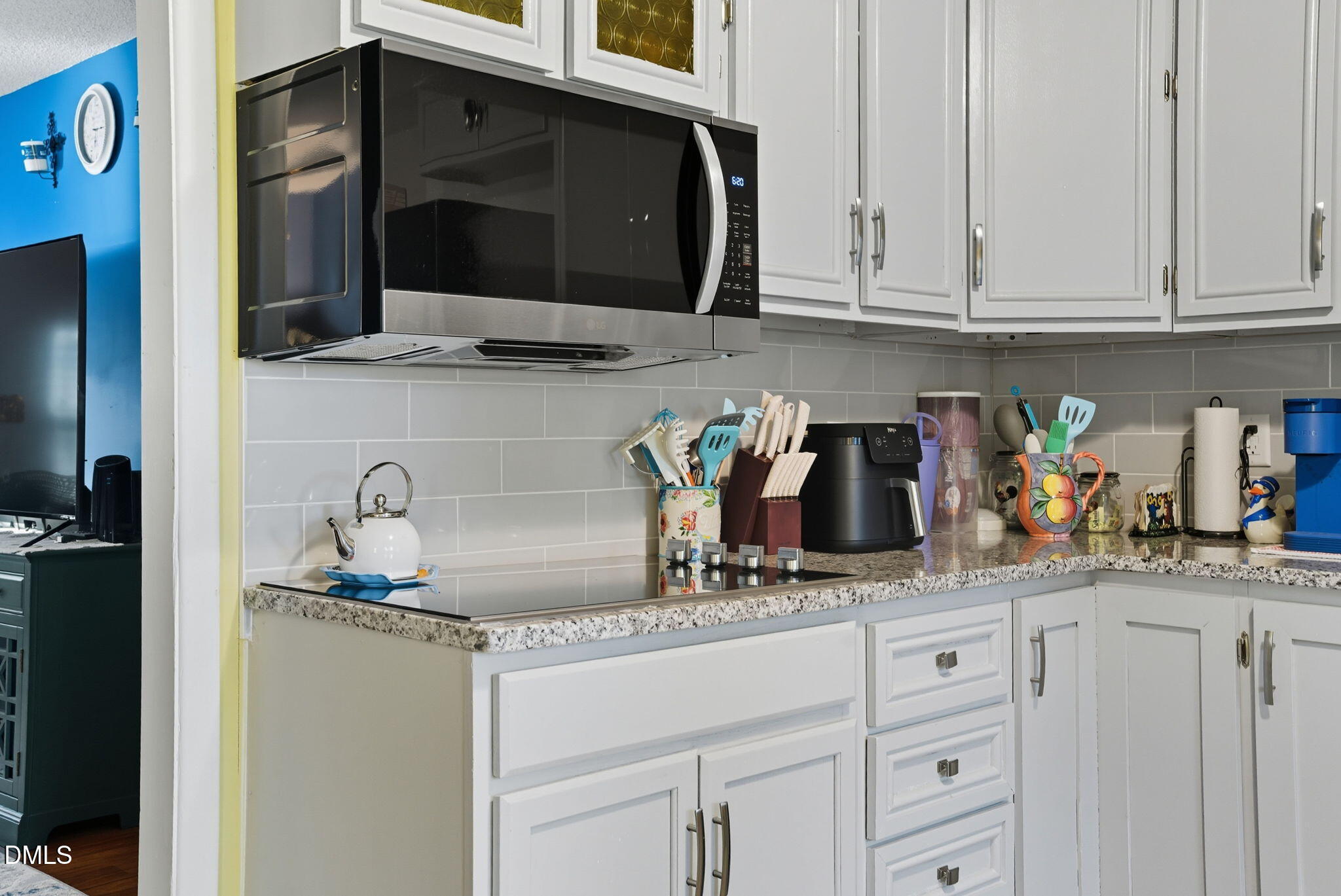 1412 Parks Village Road Zebulon, NC 27597 - Photo 14 of 40 a kitchen with stainless steel appliances granite countertop a sink and cabinets