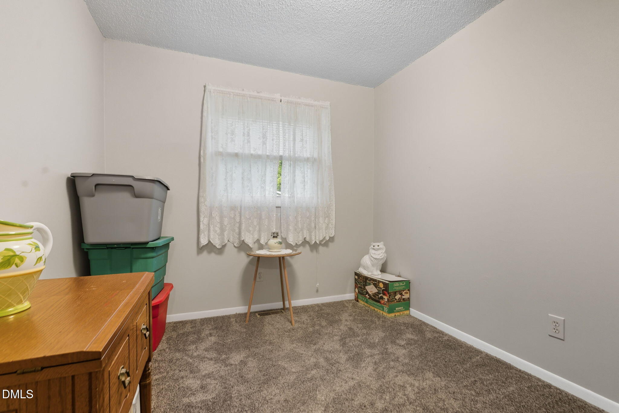 1412 Parks Village Road Zebulon, NC 27597 - Photo 23 of 40 a room with a desk and chair