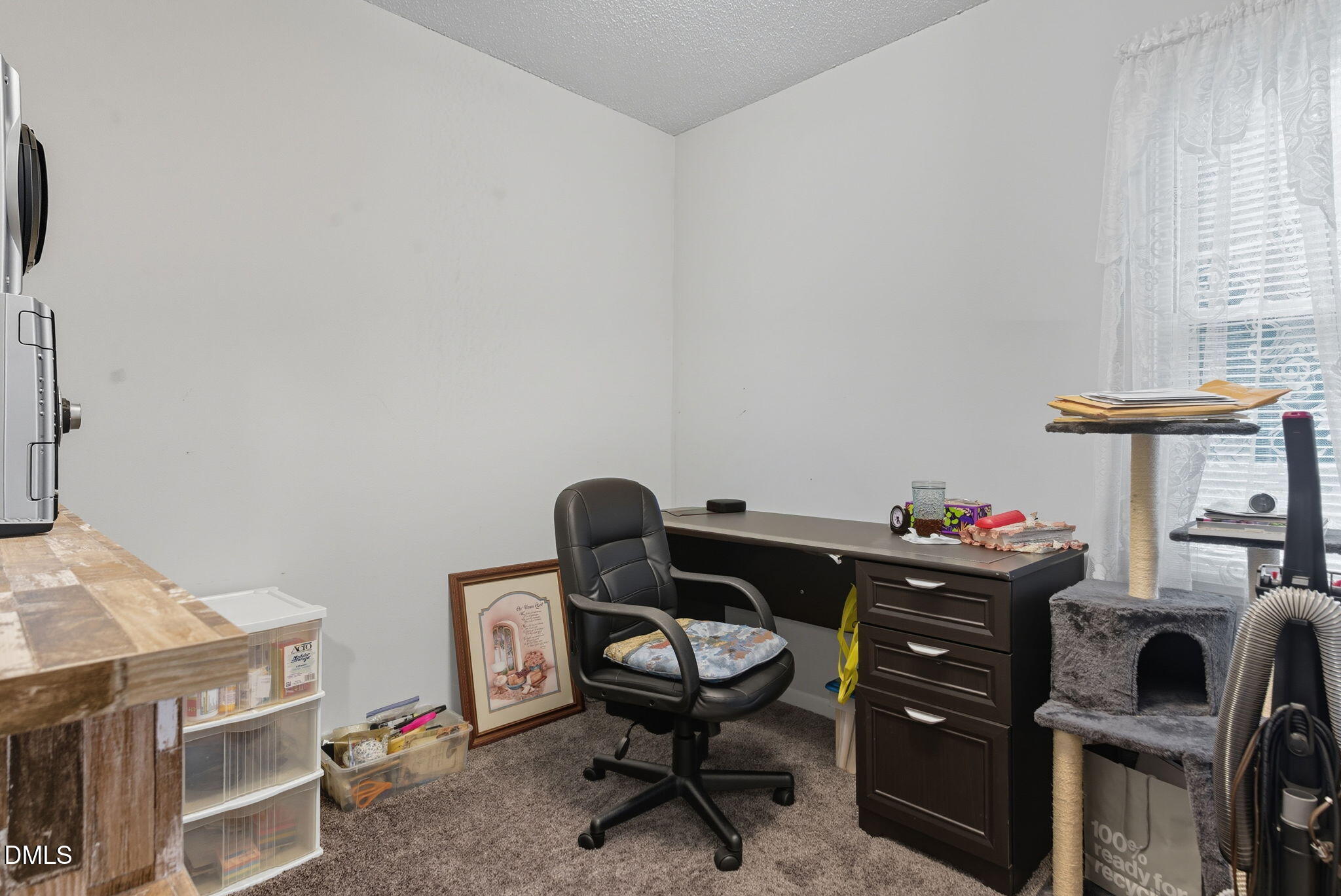 1412 Parks Village Road Zebulon, NC 27597 - Photo 26 of 40 a view of a workspace with furniture