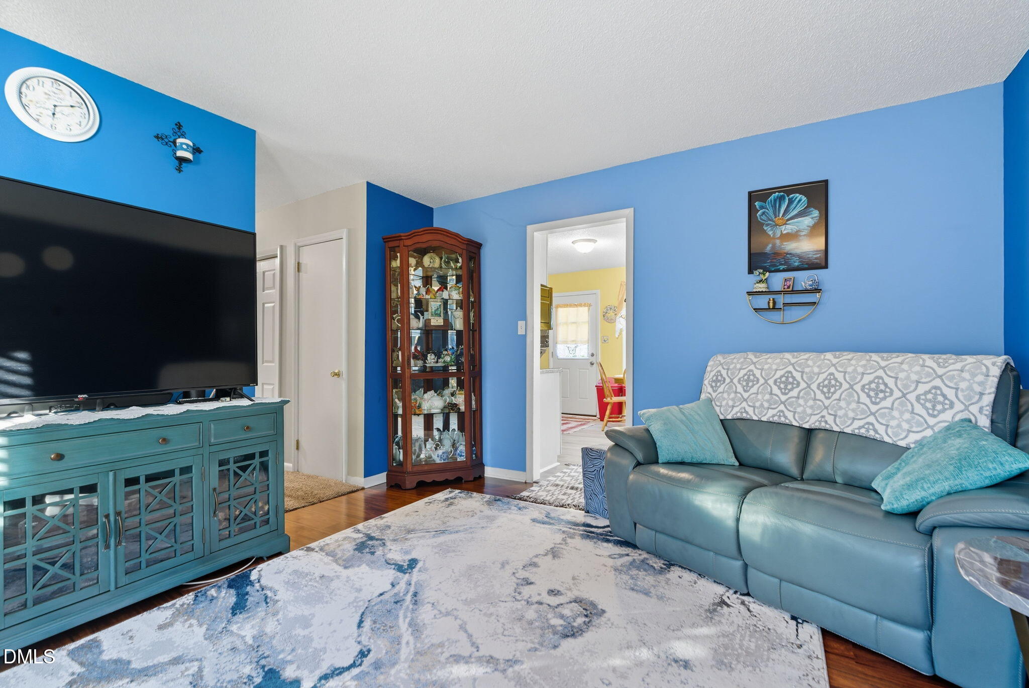 1412 Parks Village Road Zebulon, NC 27597 - Photo 6 of 40 a living room with furniture and a flat screen tv