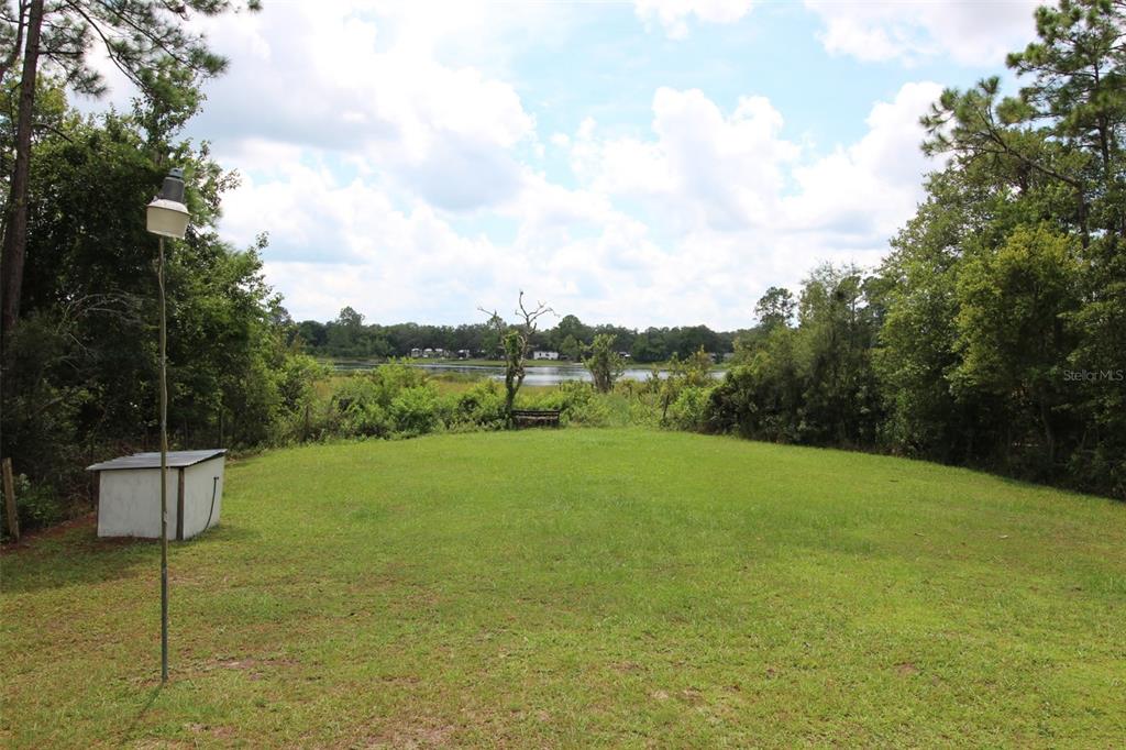 205 Susan Street Interlachen, FL 32148 - Photo 6 of 8 a view of an outdoor space and a yard
