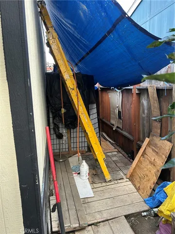 a view of deck with wooden floor and stairs
