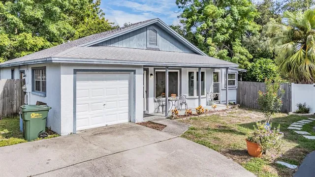 a front view of a house with a outdoor seating