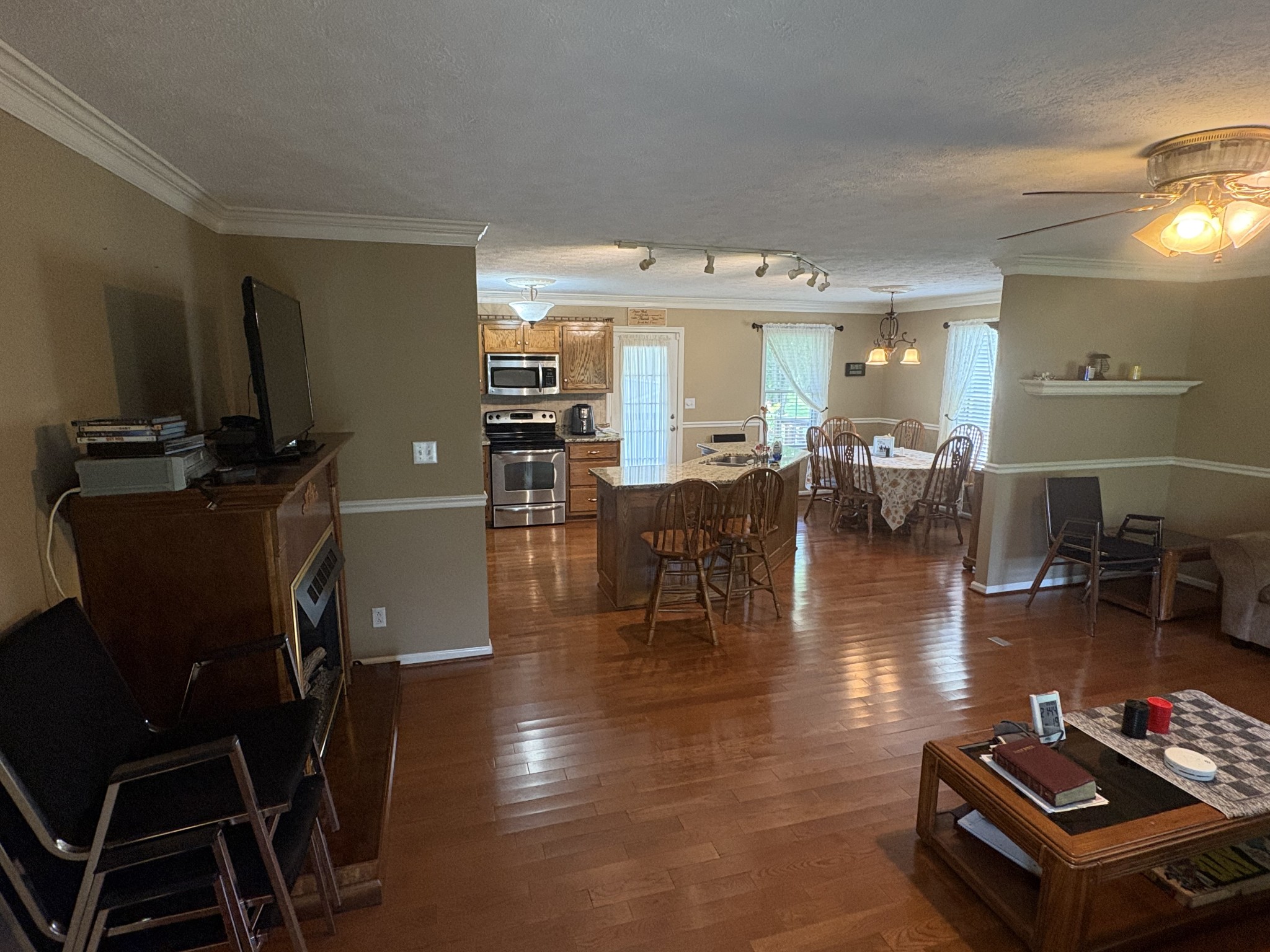 5234 Shellsford Road McMinnville, TN 37110 - Photo 11 of 59 a living room with furniture a flat screen tv and a dining table
