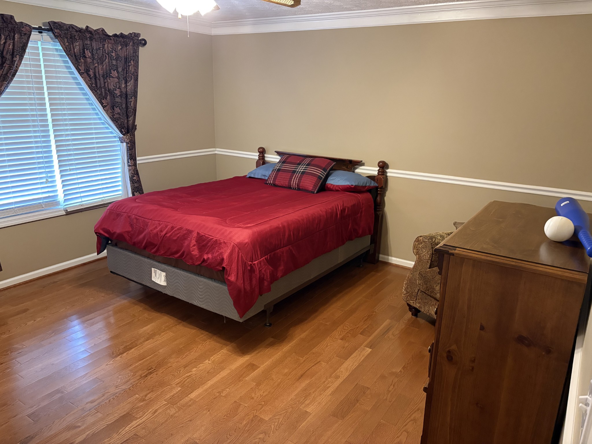 5234 Shellsford Road McMinnville, TN 37110 - Photo 17 of 59 a spacious bedroom with a bed and wooden floor