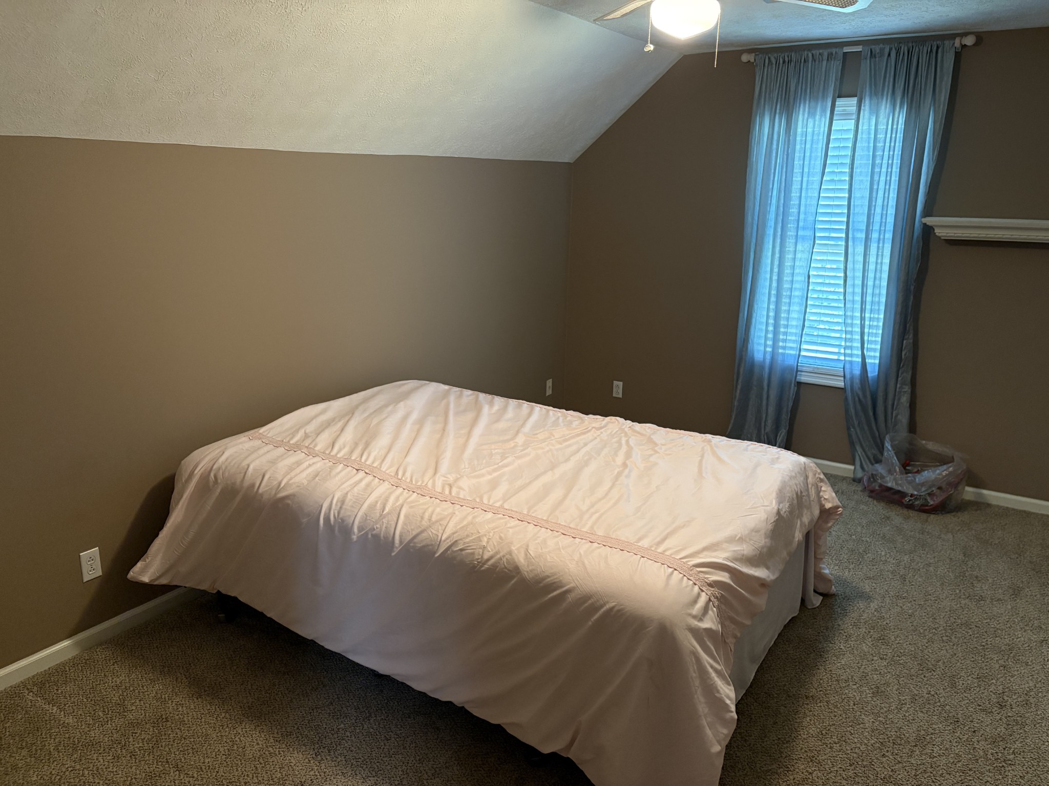 5234 Shellsford Road McMinnville, TN 37110 - Photo 39 of 59 a bed sitting in a bedroom next to a window and a mirror